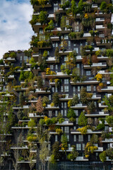 Modern architecture in Milan. Vertical forest building. Bosco Verticale skyscraper. Sustainable architecture. Vertical forest tower in Italy. Modern apartments by greenery.