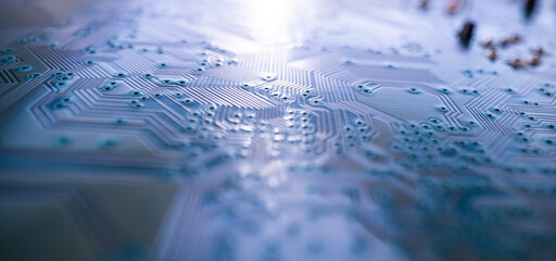 Circuit board. Technological electronic plate with roads and other components, selective focus. Technology background, electronics texture.