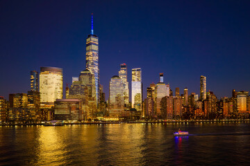 Obraz premium Manhattan at night. New York City panoramic skyline. NYC aerial cityscape. New York City downtown at night. New York panoramic cityscape. NYC night skyline with Manhattan. New York City aerial skyline