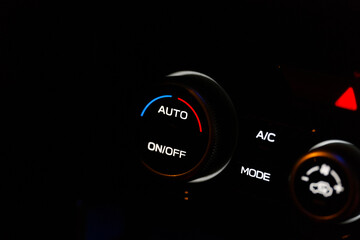 Close-up of Modern Car Interior Climate Control Panel and Air Conditioning Buttons