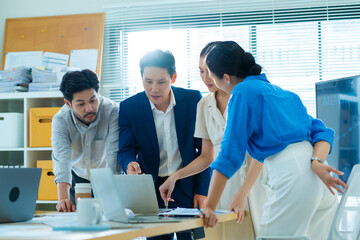 creative Business designer applaud for job success at meeting at office.Planning and brainstorm strategy is the first step.shot of a group of young Asian business people planning on a glass board. 