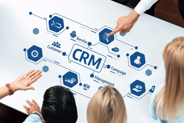 A dynamic team engages in a business strategy meeting, focusing on customer relationship management optimization with visual aids to enhance collaboration and understanding. Amity