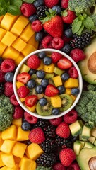 Top Down View of Healthy Fruit and Vegetable Spread Featuring Berries, Kiwi, Mango, Broccoli and Avocado