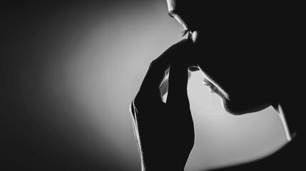 An evocative, artistic shot captures a pensive figure in deep thought, the chiaroscuro effect amplifying the emotional depth of contemplation and inner struggle.