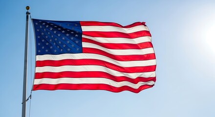 American Flag Waving Proudly Against a Clear Blue Sky.
