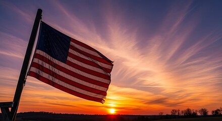 American Flag Waving Proudly Against a Vibrant Sunset Sky.