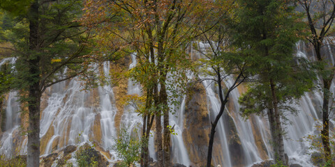 The beautiful Nuorilang Waterfall in Jiuzhaigou National Park, Sichuan Province, stands 24.5 meters...