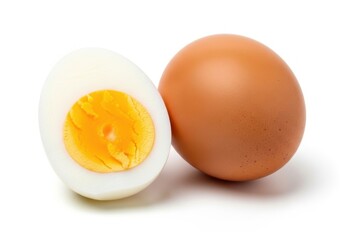 Whole and halved hard boiled egg isolated on white background