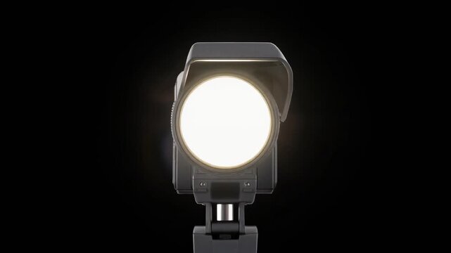 Camera Flash Bulb Popping with Bright White Light Burst Isolated on Black