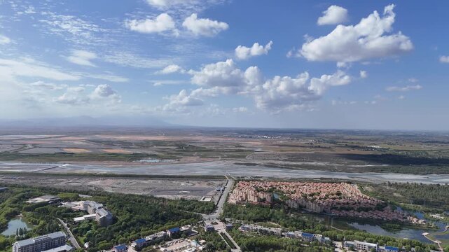 Aerial River Landscape with White Clouds and Blue Sky