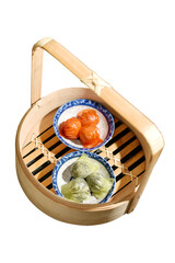 Shrimp dumplings in a bamboo basket (Beetroot dumplings and Spinach dumplings)