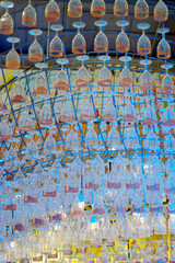 Ceiling decoration, Wine glass hang with structure and blue color lighting decorate ceiling at mall