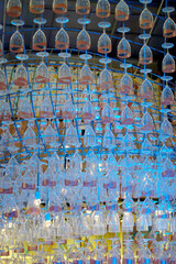 Ceiling decoration, Wine glass hang with structure and blue color lighting decorate ceiling at mall