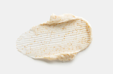 sample smear of cosmetic peeling cream on a light gray background close-up