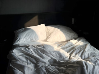 Morning Sunlight on an Unmade Bed