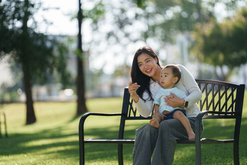 Mother and baby enjoying park view together