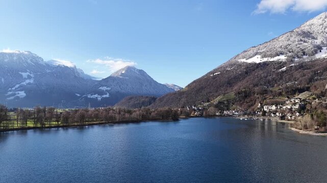 calm walensee waters framed by alpine mountains in switzerland