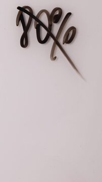 A person writes a discount percentage on a whiteboard with a marker. The number changes from eighty percent to ninety percent. A small savings increase.