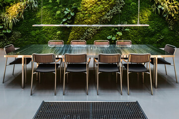 Modern conference room with living green wall and polished table office meeting