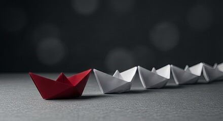Red origami paper boat leading a row of white boats, symbolic of exceptional leadership, business vision, teamwork and competitive advantage, minimalist dark grey background.