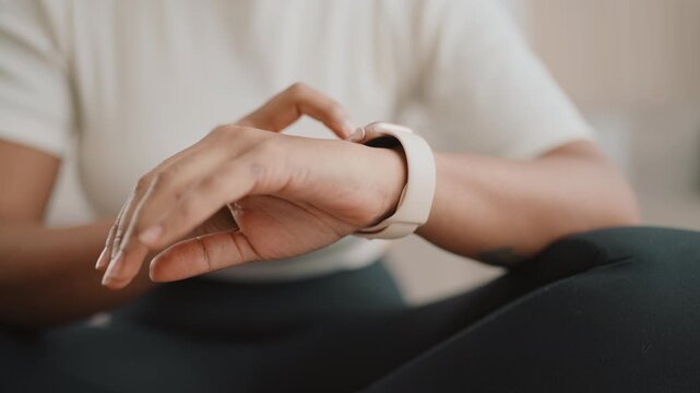 Smart band for fitness, athletic woman controlling index of body after workout. Closeup view of smartwatch on hand of young adult lady , modern technology for people, reading notification on display