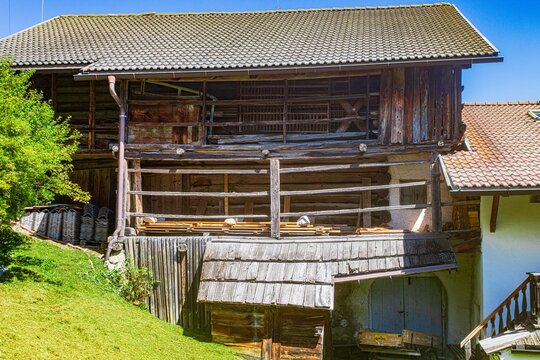 Rustic wooden barn along the traditional masi trail in Val Gardena​. South Tyrol, Italy