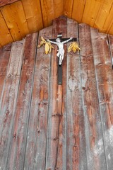 Crucifix with Jesus between two corn cobs. Rural tradition on Val Gardena, Italy