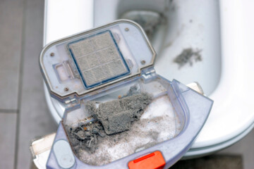 removing dust from a vacuum cleaner