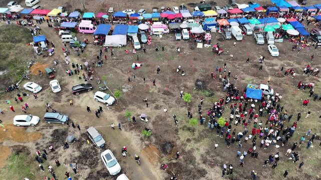 Traditional Ethnic Festival with Sea of People, Showcasing Local Customs and Joy