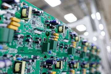 Closeup of assembled power electronics circuit board in modern manufacturing factory