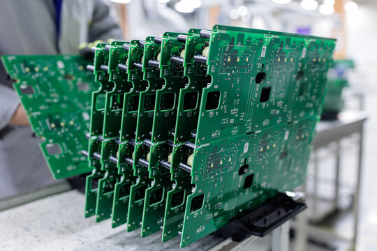 Feet in warm socks near portable electric heater in cold room at home winter heating concept