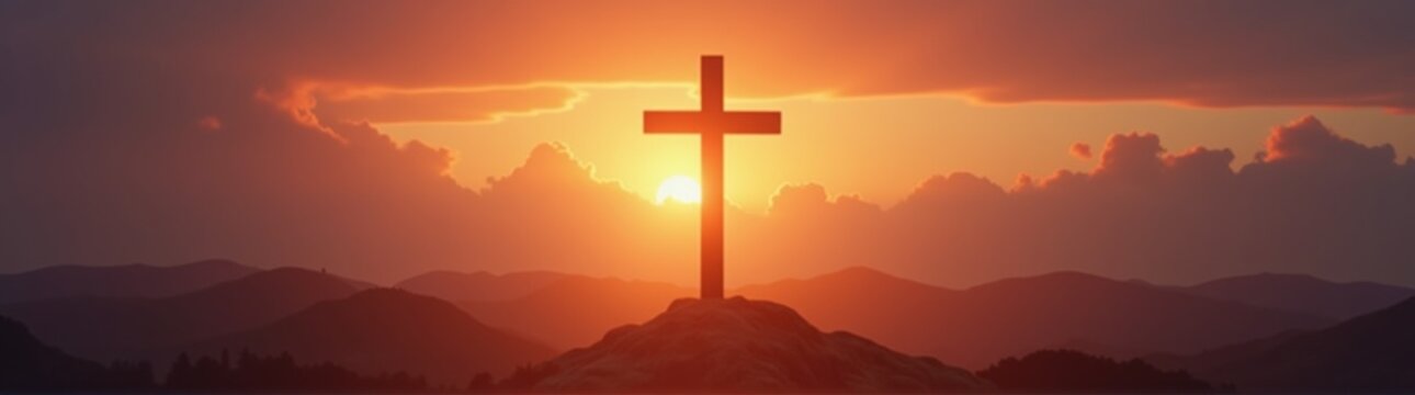 Cross on a mountain with a sunset in the background