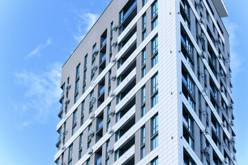 skyscraper architecture living modern building triangle shape facade gray and white walls with...