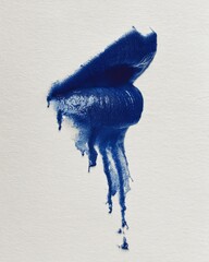 Close-up of dark blue lipstick dripping from lips on a textured white background