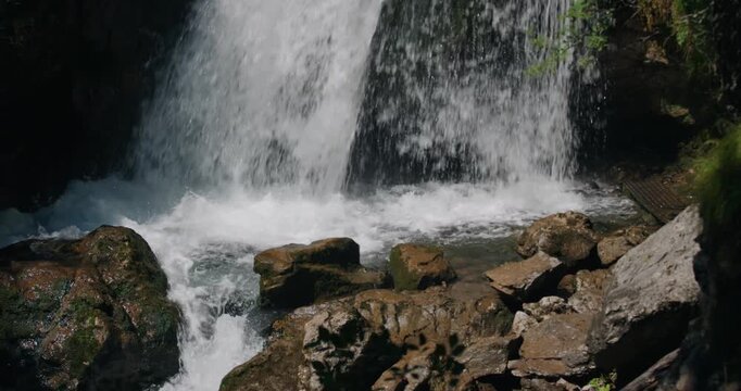 hamanic moment at a waterfall in the &Ouml;tschergr&auml;ben, in Grand Canyon of Austria where crashing mountain water meets ancient limestone to create space for deep spiritual reflection and natural healing.