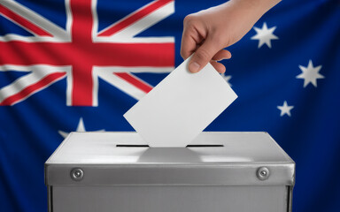 Casting a vote for Australia's future with ballot box and flag, symbolizing democracy and civic duty for informed decisions