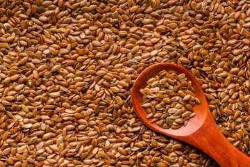 Brown linseed or flaxseed and oil. Healthy flax seed. Top view.