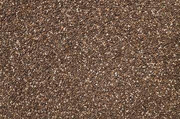 Chia seeds macro, texture. Food background, healthy eating concept, superfood. Dry organic chia seeds rich in omega-3, protein, vitamins and minerals. Chia seeds close up