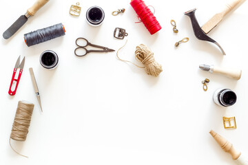 Leather craft work tools flat lay. Tailor or shoemaker on workplace, top view