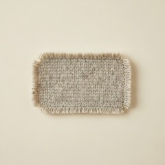 Textured Wool Patch with Fringed Edges on Neutral Background Display