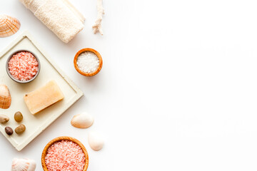 Essential oil in bottles and spa cosmetics with towels, top view. Beauty spa therapy cosmetics and wellness flat lay