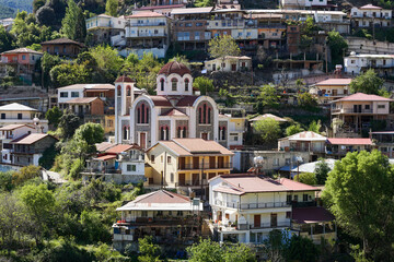 Orthodox church in Pedoulas village in mountains aerial panoramic view, Cyprus