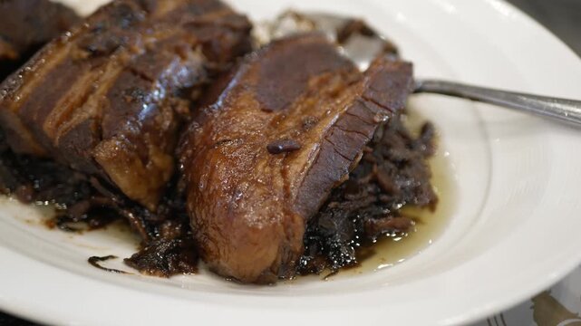 Braised Pork Belly with Preserved Mustard Green or mei cai kou rou, a chinese cuisine plate for lunch meal ready to eat in homemade style, lunch meal chinese food