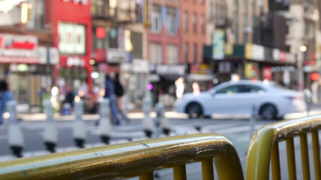 Manhattan Midtown street New York City, United States. Crossroad near Port authority bus terminal. Defocused car traffic on urban road, 8th avenue in Hells Kitchen. People pedestrian, yellow taxi cab.