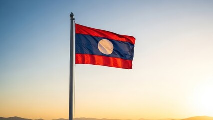 The national flag of a Southeast Asian country flies proudly against a clear, sunny sky