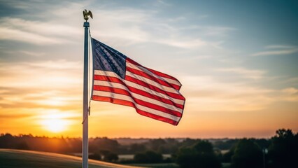 USA flag waves proudly in the wind at sunset, with eagle atop flagpole, and fields