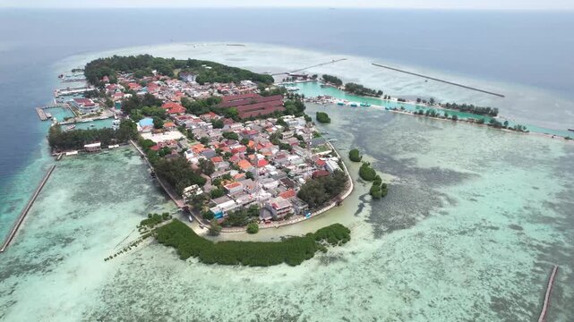Coastal area of Pulau Pramuka in the Thousand Islands, featuring tropical shoreline, clear sea, and island ecosystem.