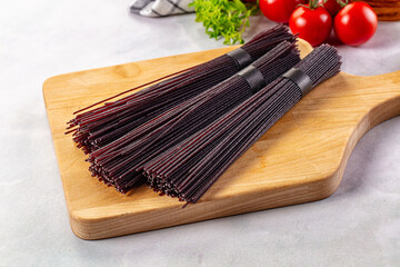 Raw black rice noodles lines