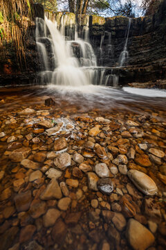 The garden of eden waterfall after December heavy in Ashdown forest on the high weald east Sussex south east England UK