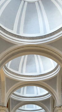 Repetitive neoclassical architecture creating symmetrical ceiling domes
